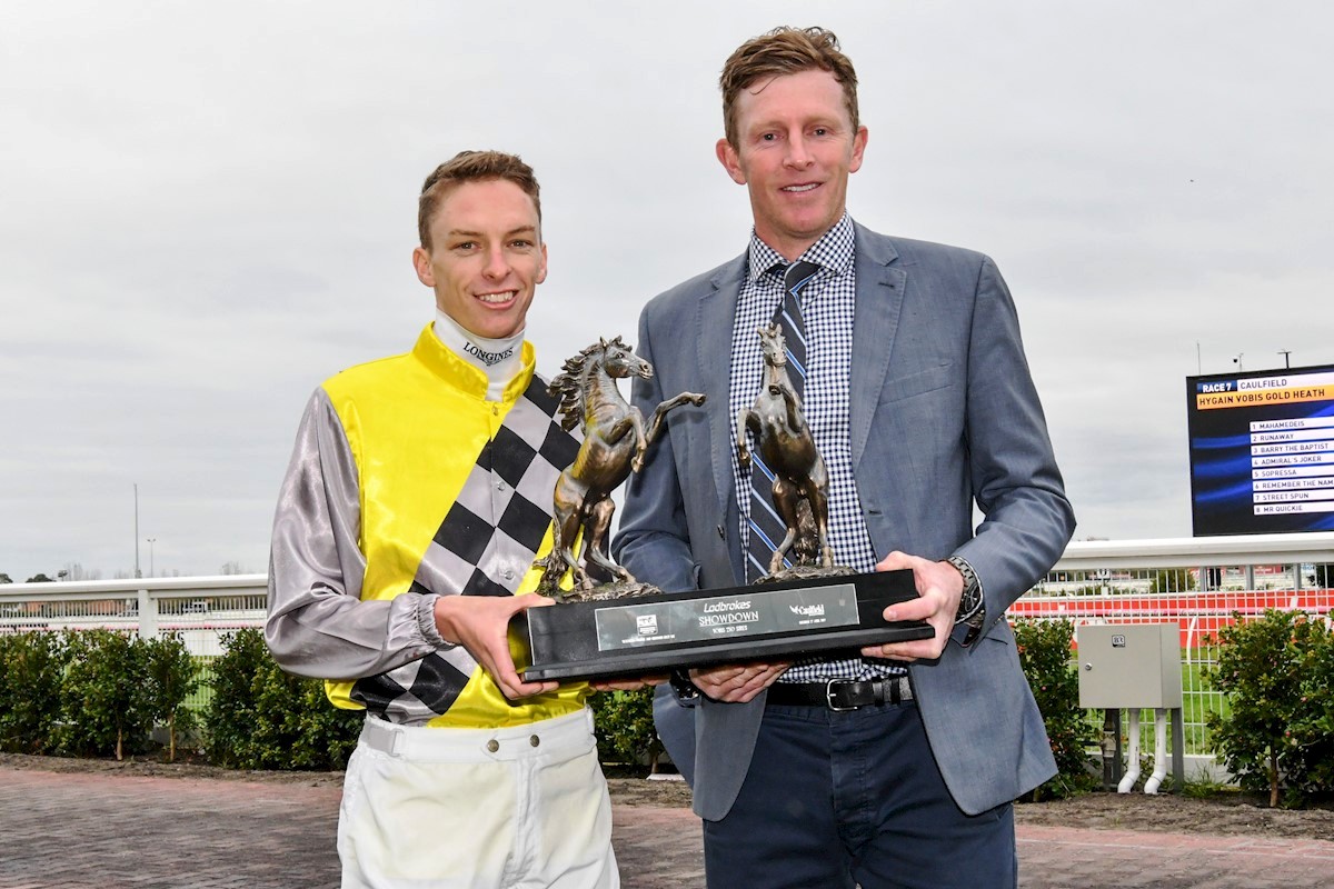 Jockey Michael Dee & Matt with the impressive Showdown trophy Jockey Michael Dee & Matt with the impressive Showdown trophy